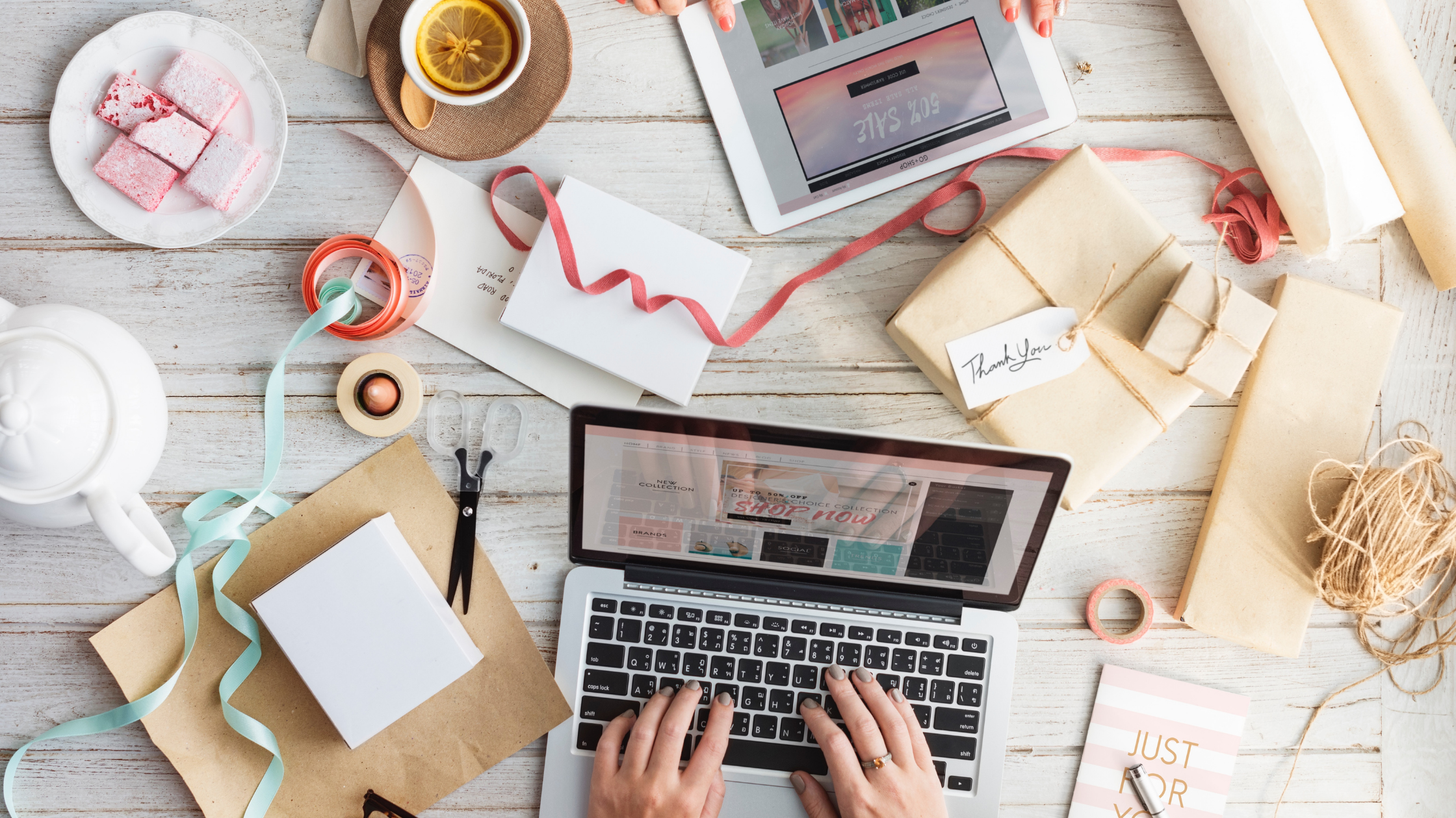 typing-on-labtop-on-desk-that-has-coffee-cup-and-paper-everywhere