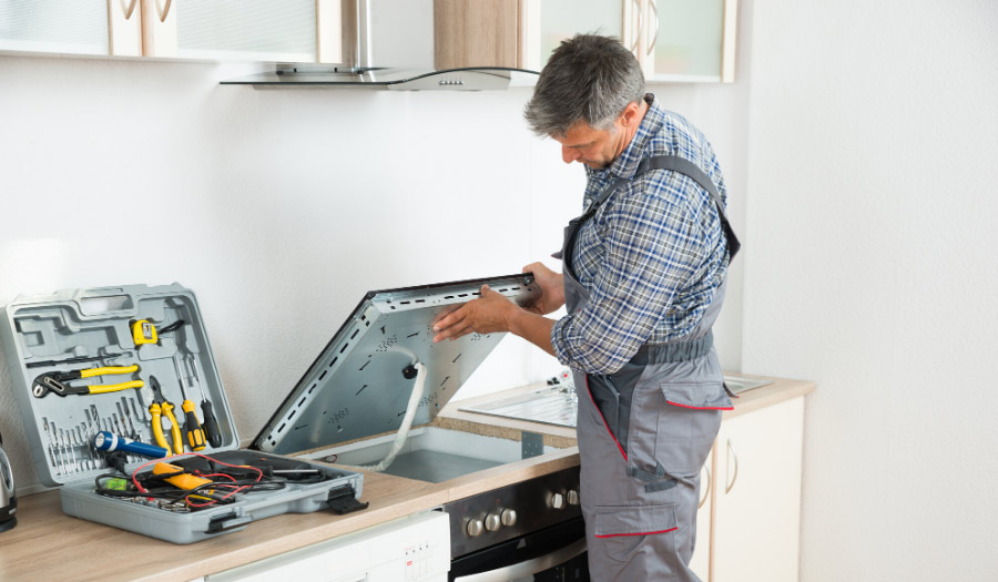 plumber-working-on-a-dishwasher