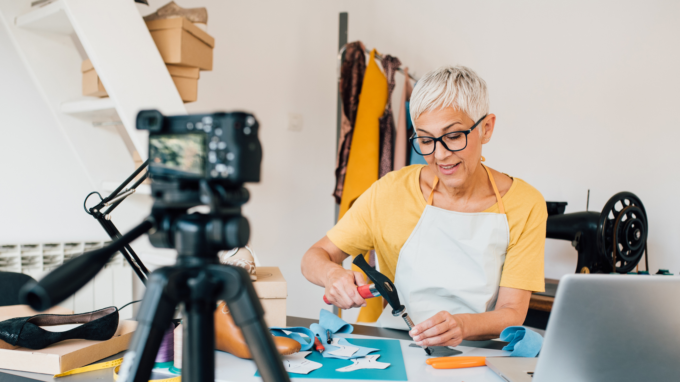 woman vlogging while demonstrating how to craft